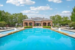 New Albany apartment for rent - A large swimming pool in front of a house.