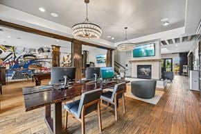 New Albany apartment for rent - A modern dining room with a wooden table and chairs.