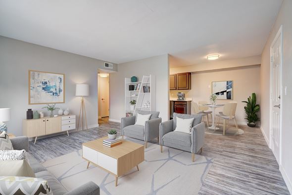 Bethany apartment for rent - A living room with a grey couch, a white coffee table, and a painting on the wall.