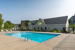Cincinnati apartment for rent - A pool with a building behind it.