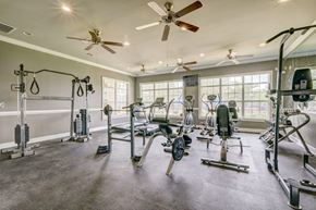 Augusta apartment for rent - a gym with weights and other equipment and windows