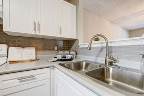 Salisbury apartment for rent - a kitchen with a sink and white cabinets