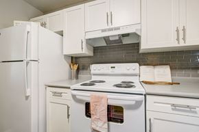 Salisbury apartment for rent - a kitchen with white appliances and white cabinets