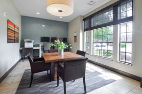 Louisville apartment for rent - A dining room with a table and chairs.