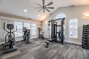 Blacklick townhouse for rent - A spacious home gym with a variety of exercise equipment.
