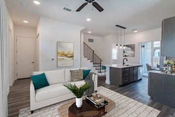 Mckinney townhouse for rent - a living room with a couch and a table