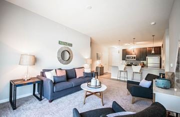 Lewis Center townhouse for rent - A living room with a grey couch and a coffee table.