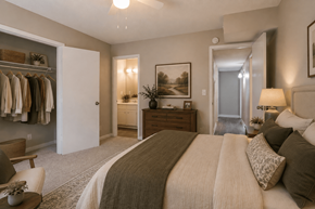Rock Hill apartment for rent - A bedroom with a large bed and a painting on the wall.