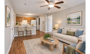 High Point apartment for rent - A living room with a couch, chairs, and a coffee table.