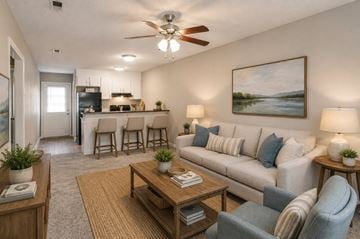 Huntersville apartment for rent - A living room with a couch, chairs, and a painting on the wall.