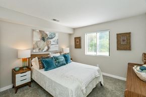 Indianapolis townhouse for rent - a bedroom with a bed and a window