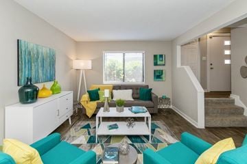 Indianapolis townhouse for rent - A living room with a white sofa and a white coffee table.