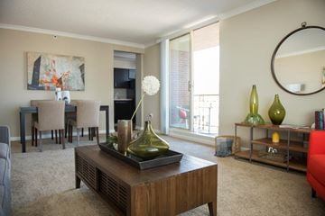 Louisville apartment for rent - A living room with a brown coffee table and a painting on the wall.