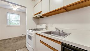 Reading apartment for rent - a kitchen with a sink and a stove and a window