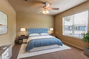 Augusta apartment for rent - a bedroom with a bed and a ceiling fan