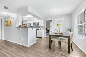Louisville apartment for rent - A kitchen with a dining table and chairs.