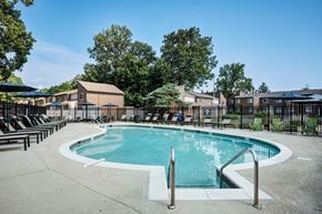 Indianapolis townhouse for rent - A round swimming pool surrounded by a concrete floor and metal railings.