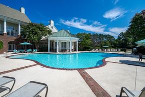 Fayetteville apartment for rent - A pool with a gazebo in the middle of it.