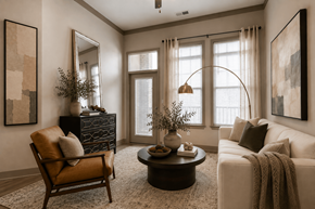 Cornelius apartment for rent - A living room with a brown chair, a white couch, and a coffee table.