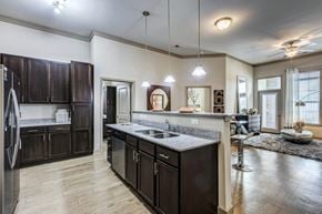 Cornelius apartment for rent - A modern kitchen with dark wood cabinets and a large island.