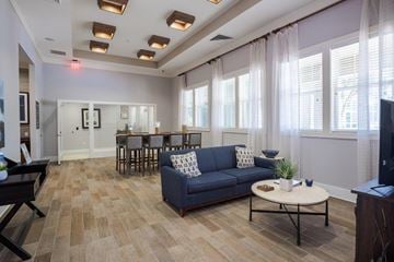 Jacksonville apartment for rent - a living room and dining room with a couch and a table