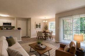 Columbia townhouse for rent - A living room with a couch, chairs, and a coffee table.
