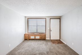 Miamisburg apartment for rent - A room with a window and a door.