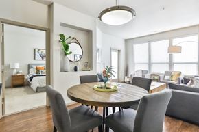 Saint Charles apartment for rent - A modern dining room with a round table and grey chairs.