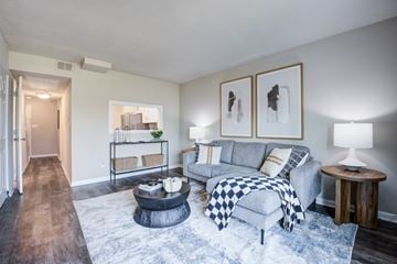 Indianapolis townhouse for rent - A living room with a grey couch and a coffee table.