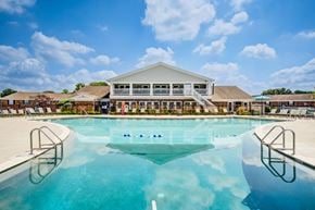 Indianapolis townhouse for rent - A large swimming pool in front of a building.