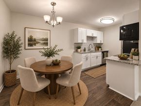 Fayetteville apartment for rent - A dining room with a round table and chairs.