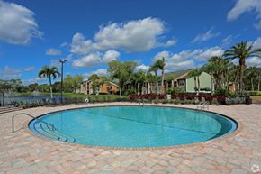 West Palm Beach apartment for rent - A swimming pool surrounded by a brick border.
