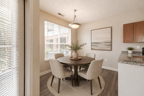 Fayetteville apartment for rent - A dining room with a table and chairs.