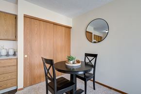 Columbus townhouse for rent - a dining area with a table and two chairs and a mirror