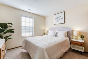 Columbus townhouse for rent - a bedroom with a bed and a window