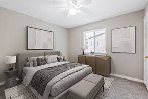 Charlotte apartment for rent - staged bedroom with wall to wall carpeting