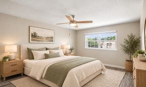 Bethany apartment for rent - A bedroom with a bed, nightstands, and a ceiling fan.