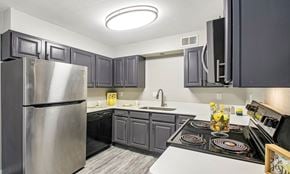 Bethany apartment for rent - A kitchen with a stove top oven and a refrigerator.