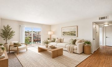 Bethany apartment for rent - A living room with a couch, chair, and a painting on the wall.