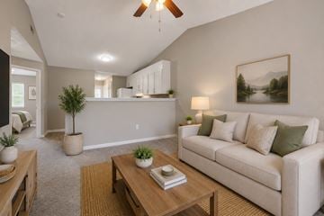 Monroe apartment for rent - A living room with a couch, coffee table, and a painting on the wall.