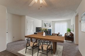 Fayetteville apartment for rent - A dining room with a wooden table and chairs.
