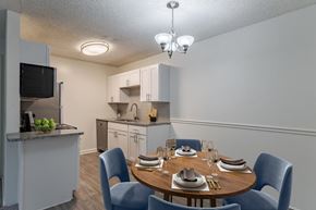 Fayetteville apartment for rent - A kitchen with a dining table set for four.