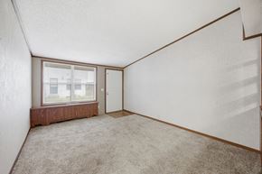 Miamisburg apartment for rent - Empty room with a window and a door.