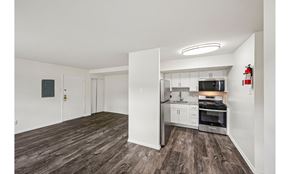 Allentown apartment for rent - A kitchen with white cabinets and a stainless steel refrigerator.