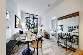 Plantation apartment for rent - living area with small dining table bar cart and sofa