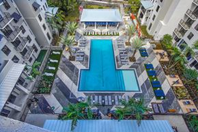 Plantation apartment for rent - a view of the pool from above of an apartment building with a swimming pool