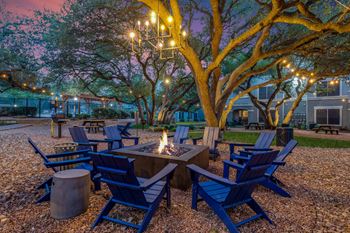 Evening-lit courtyard with central fire pit