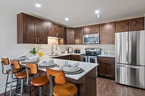 Salt Lake City apartment for rent - Kitchen with dark cabinets, stainless steel appliances and granite countertops