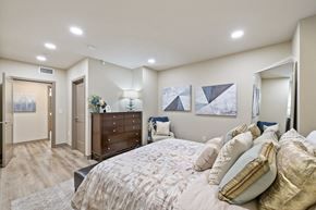Salt Lake City apartment for rent - a bedroom with a large bed and a dresser