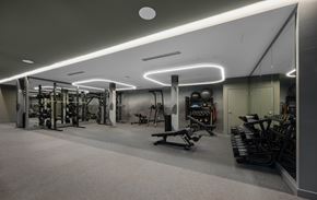 Cambridge apartment for rent - A well-lit gym with various exercise equipment.